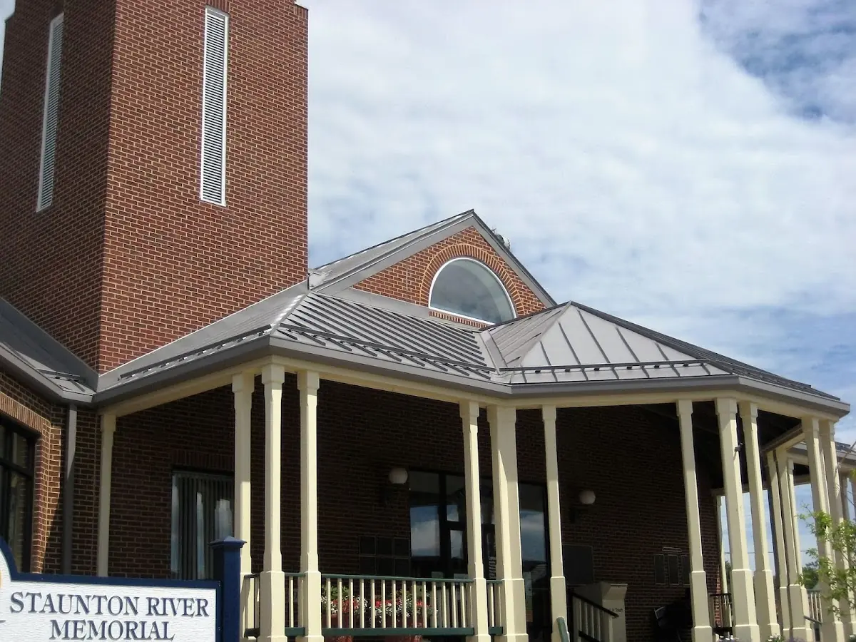 Skilled roofing craftsmen working on a residential roof in Alamosa
